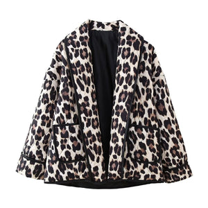 Leopard quilted kimono jacket with pockets and black trim.