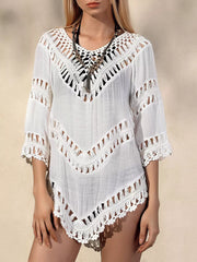 White chevron crochet V-neck cover-up with fringe details and cutout accents.