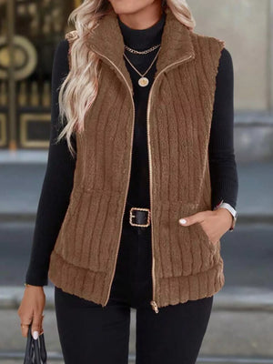 Brown fleece zip-up vest with pockets and ribbed texture.