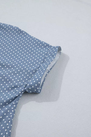 Polka dot short sleeve shirt in blue polyester with cuffed sleeves.