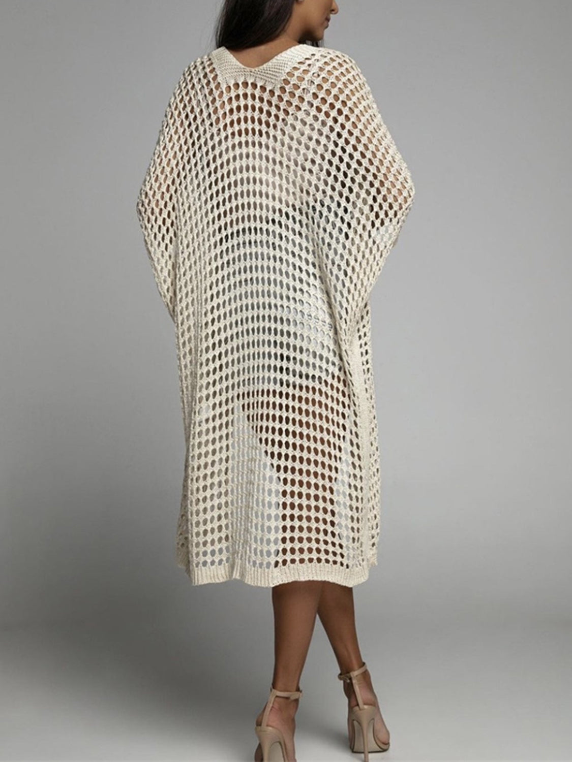 Cream open-knit duster cardigan with a relaxed fit and V-neckline.