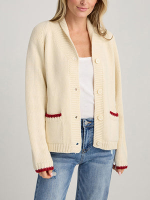 Cream knit cardigan with red trim on pockets and cuffs, button front, shawl collar