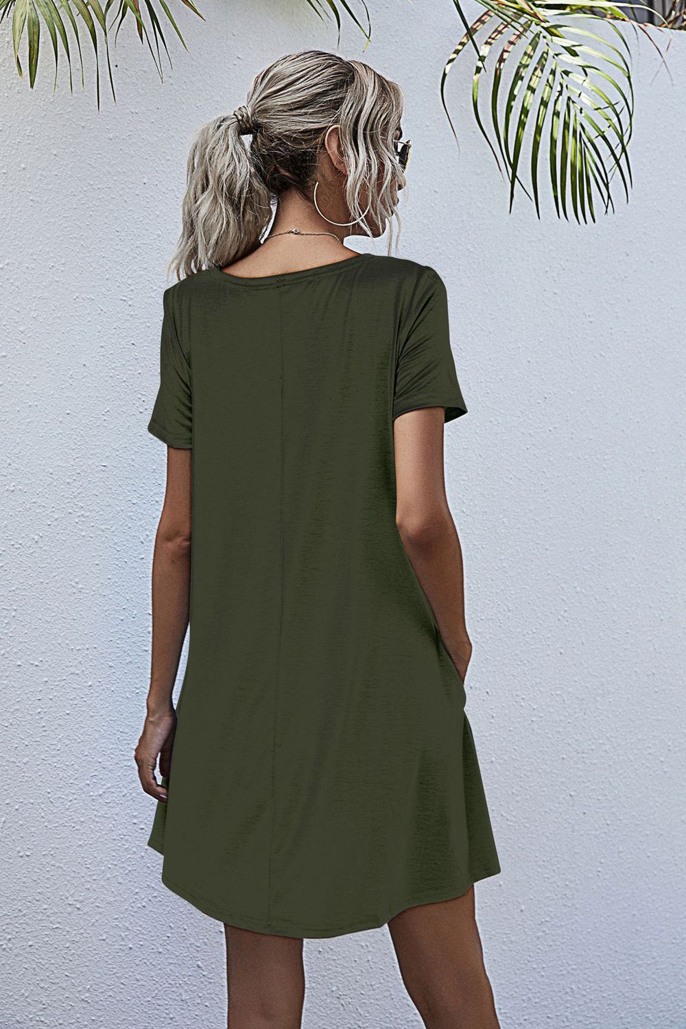 Relaxed pocketed tee dress in army green with short sleeves and a casual A-line cut.