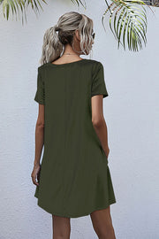 Relaxed pocketed tee dress in army green with short sleeves and a casual A-line cut.