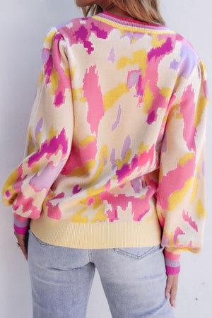 Abstract brushstroke knit sweater with puff sleeves in floral print.