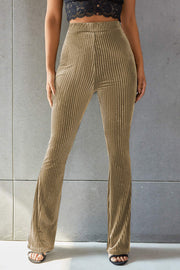 Khaki ribbed velvet palazzo trousers with a flared leg.