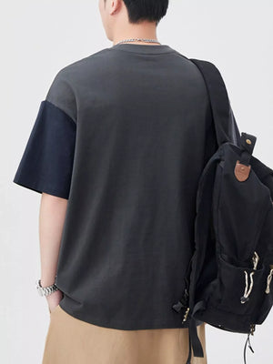 Oversized cotton t-shirt with color block sleeves in dark gray and navy blue.