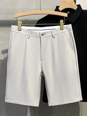 Men's light gray chino shorts with a button and zip fly, classic pockets.