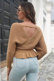 Camel ruffled wrap knit sweater with open back detail and peplum hem.