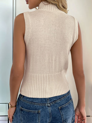 Tan ribbed knit zip-front vest with mock neck and fitted waist