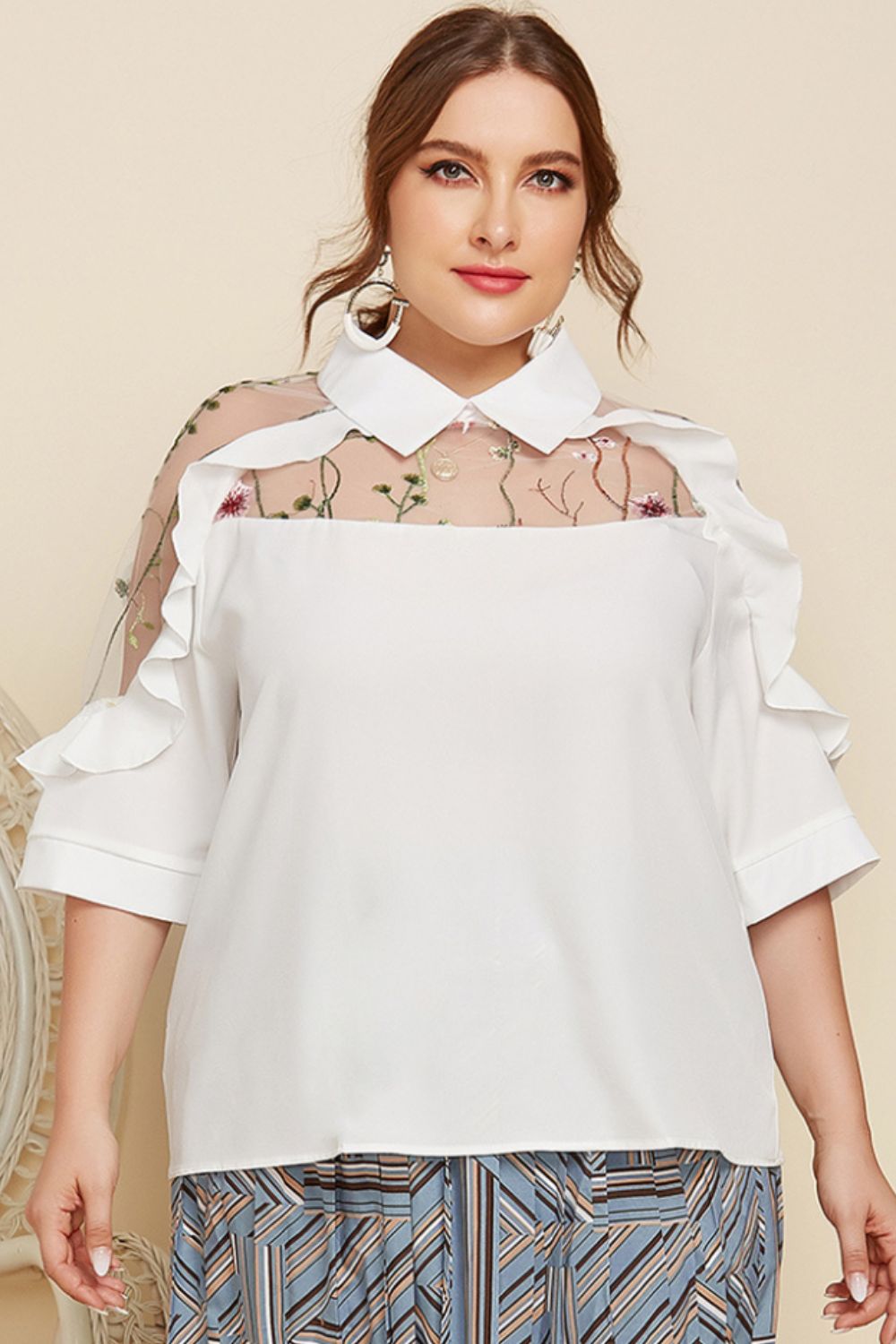 White ruffle sleeve blouse with sheer embroidered yoke and collar.