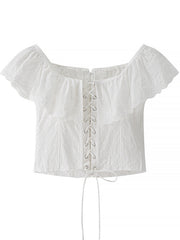White eyelet lace-up corset tank top with ruffle trim and short sleeves.