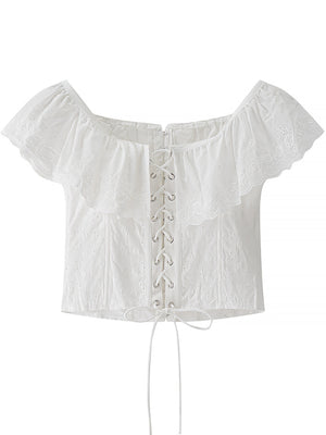 White eyelet lace-up corset tank top with ruffle trim and short sleeves.
