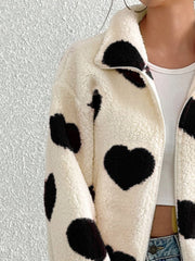 Heart print sherpa zip-up jacket with a collared neckline and full zip closure.