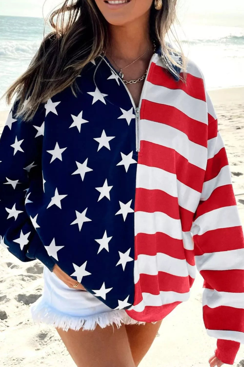 Patriotic print half-zip sweatshirt with stars and stripes, made of polyester.
