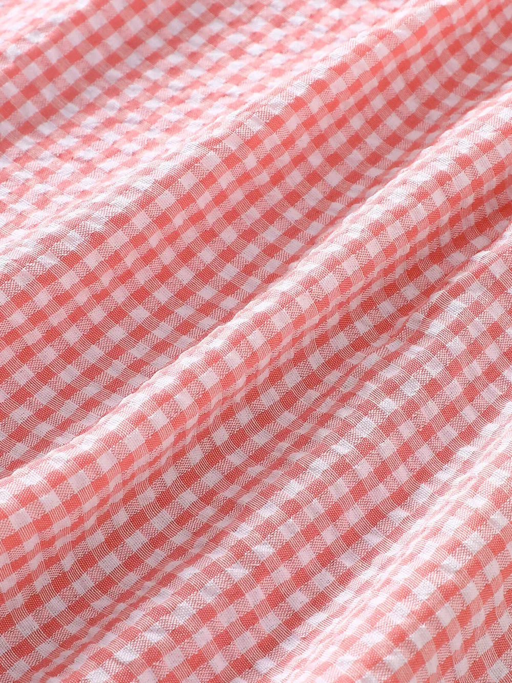 Children's Smocked Plaid Ruffle Sleeve Dress in Pink, model styling view