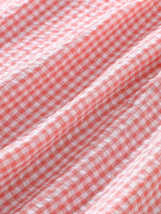 Children's Smocked Plaid Ruffle Sleeve Dress in Pink, model styling view