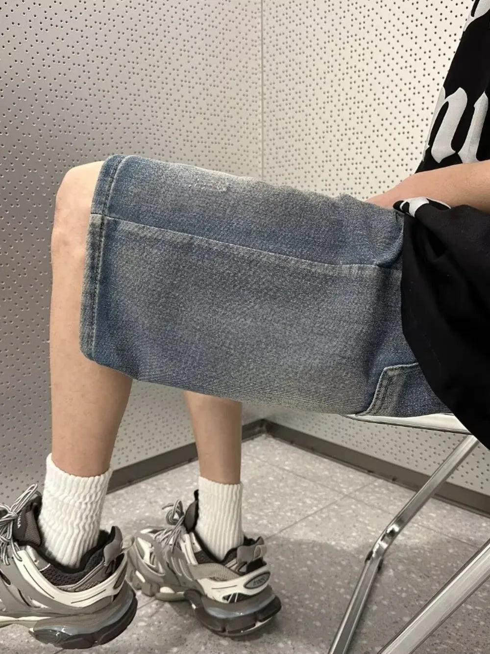 Men's vintage wash stretch denim shorts in light blue with a relaxed fit.