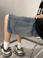 Men's vintage wash stretch denim shorts in light blue with a relaxed fit.