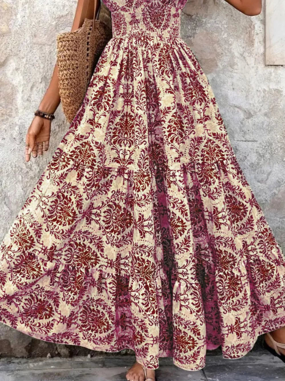 Maxi dress with smocked bodice and tiered skirt in a damask print.