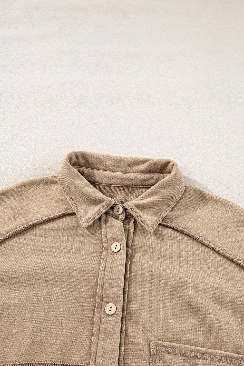 Tan waffle knit overshirt with collar, button front, and patch pocket detail.