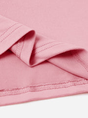 Blush pink oversized graphic tee showing hem and seam detail.