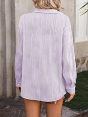 Lavender textured pleat oversized button-down shirt with long sleeves.