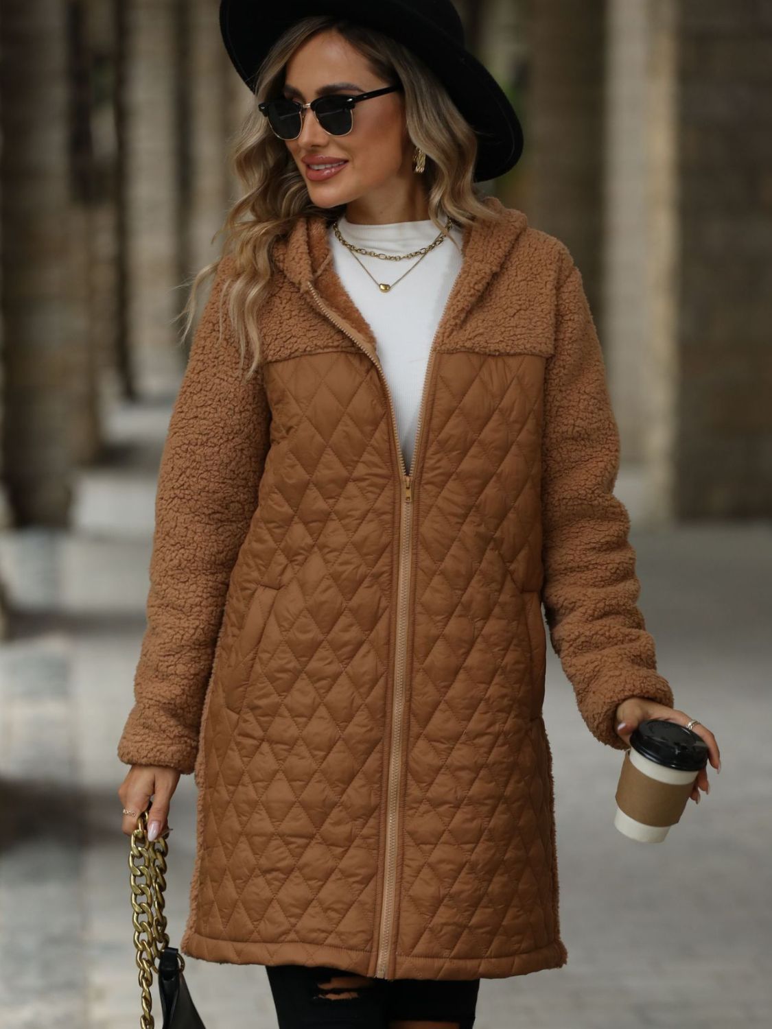 Caramel teddy and quilted hybrid coat with hood and zipper closure.