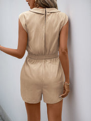 Tan structured shoulder pocket romper with elastic waist and collared neckline.