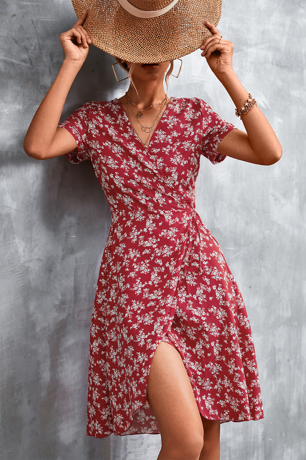 Crimson floral wrap midi dress with short sleeves and a thigh-high slit.