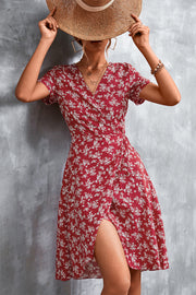 Crimson floral wrap midi dress with short sleeves and a thigh-high slit.