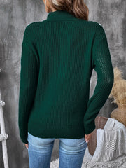 Dark green textured knit sweater with chevron trim and zip neck.