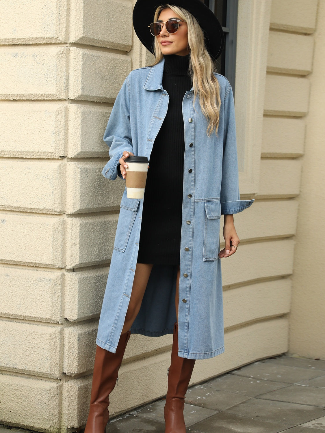 Light blue oversized denim duster jacket with button front and chest pockets.