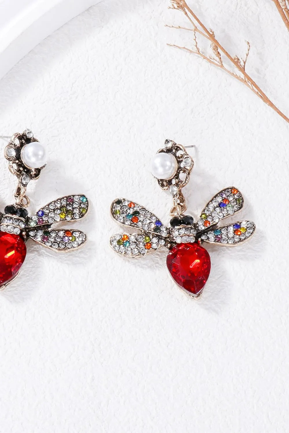 Red jeweled dragonfly chandelier earrings with colorful crystal wings and pearl accent