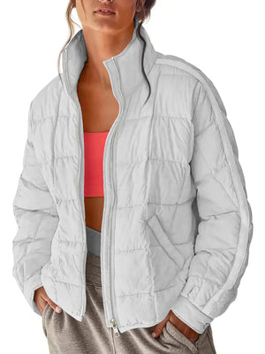 White quilted bomber jacket with stand collar and zipper closure