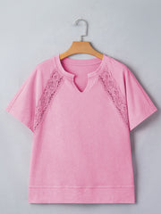 Pink mineral wash cotton tee with notched neck and lace inset details.