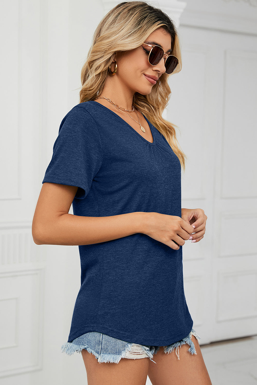 Heathered blue v-neck t-shirt with short sleeves and a relaxed fit.
