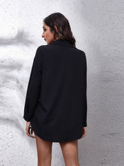 Black button-down shirt with long sleeves and a classic collar.