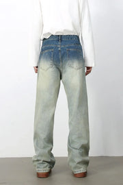 Faded wash wide-leg jeans with drawstring waist and relaxed fit.