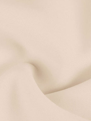 Apricot one-shoulder mini dress with bowknot detail.