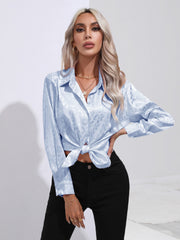 Light blue satin leopard print button-down shirt with knotted hem