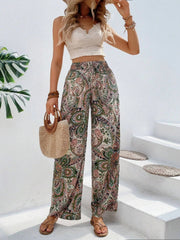 Paisley palazzo trousers with drawstring waist in multicolor, featuring a boho print and wide leg cut.