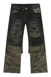 Distressed dark wash flare jeans with camo panels and rips.