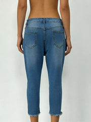 Sky blue cotton capri jeans with raw hem and pockets.