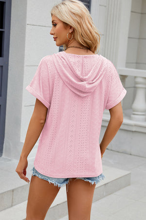 Perforated blush pink hooded tee with short sleeves and a relaxed fit.