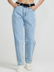 Light wash denim jeans with a high rise and straight leg, styled with a studded belt.