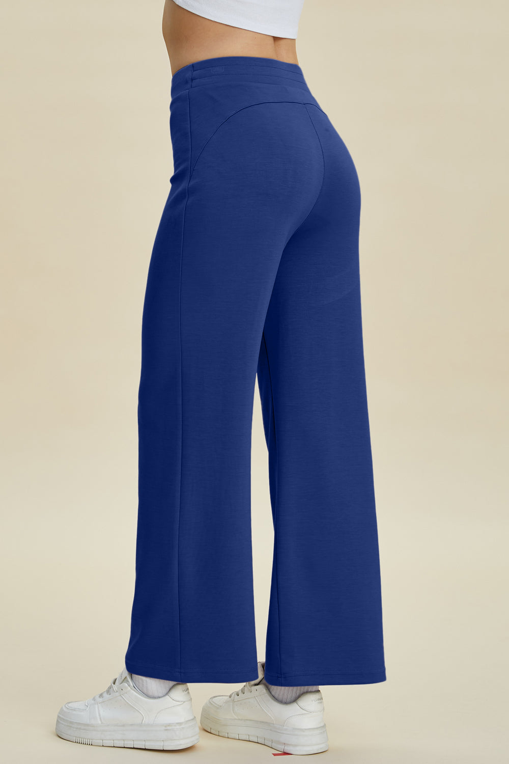 Blue wide leg lounge pants with a soft drape and high waist.