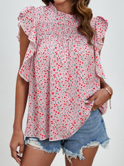 Blush pink floral blouse with smocked yoke and ruffle sleeves