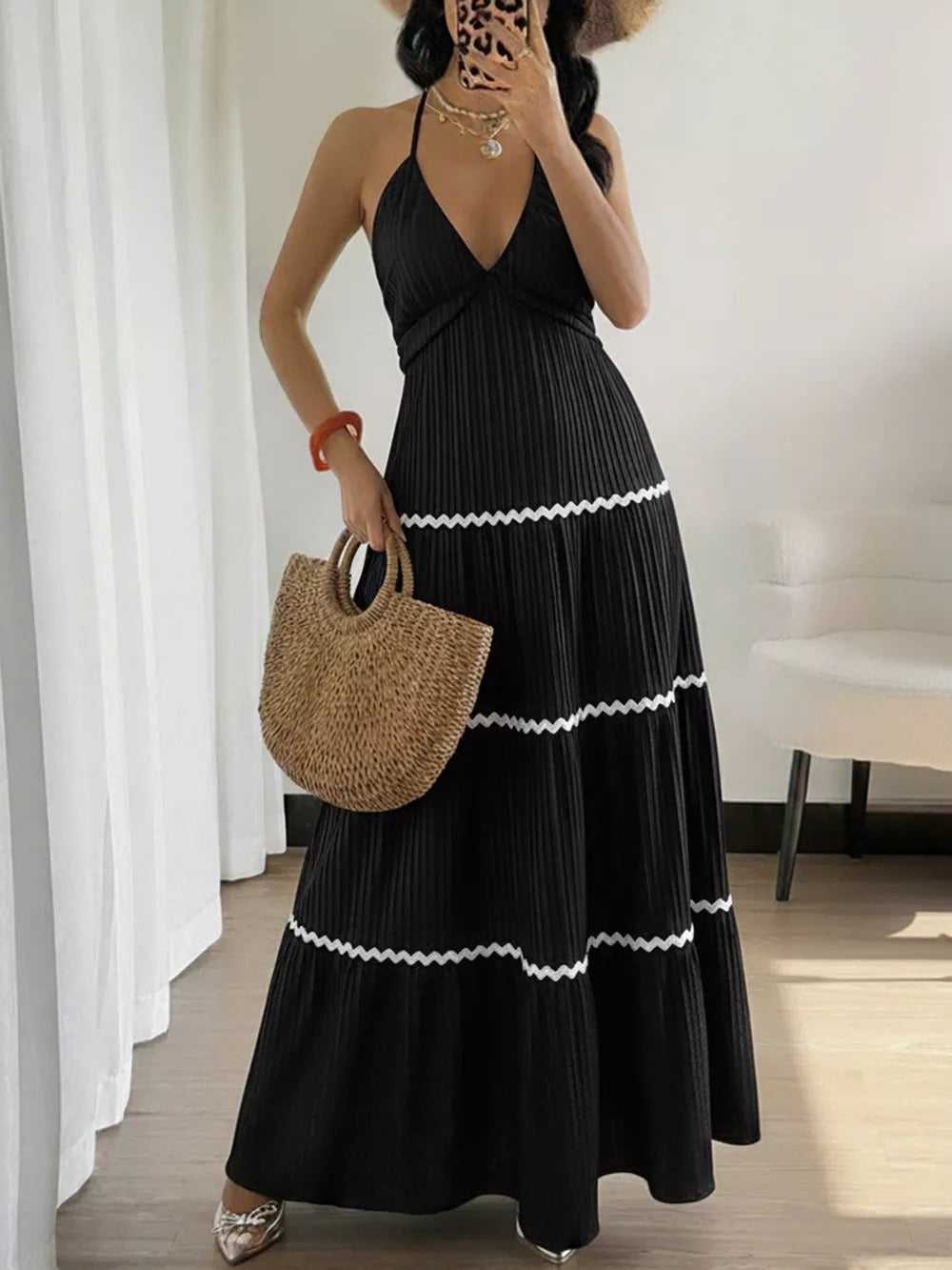 Black ruched halter maxi dress with tiered skirt and white trim