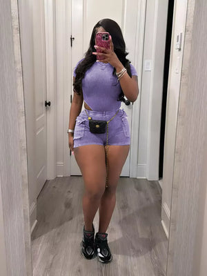 Purple ribbed crop top and shorts set with pockets and chain belt detail.